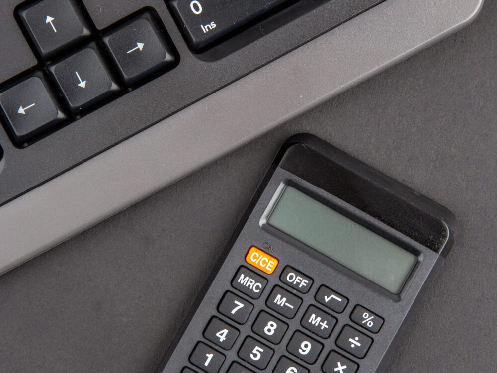 top-view-black-office-stuffs-keyboard-calculator-o-2025-02-09-22-59-42-utc-scaled.jpg